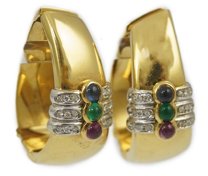 A large modern pair of Mappin & Webb 18ct gold, cabochon ruby, emerald and sapphire and diamond chip set oval loop earrings